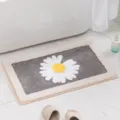 Soft gray daisy bath mat with plush fabric and non-slip backing for bathroom floor. - Gray White Daisy