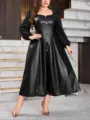 Detail view of a chic plus size black faux leather midi dress featuring stylish front buttons. - 008