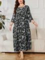 Detalle de elegante vestido midi floral gris, con cómodo escote redondo y diseño amplio. - 2XL / 0042