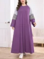 Plus size long sleeve maxi dress featuring contrast striped and leopard print sleeves. - 006
