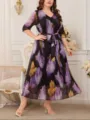 Dettaglio dell'abito midi plus size con stampa floreale, scollo a V e cintura in vita. - 1XL / Vestiti / Floreale Nero