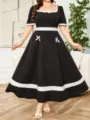 Elegantes Damen Übergröße Schwarzes Kleid Mit Weißem Kontrastbesatz Hauptansicht. - Stil 251