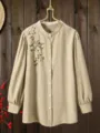 Light khaki long sleeve button up blouse with elegant floral embroidery and mandarin collar. - Color 27