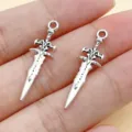 Antique silver alloy sword dagger charms, perfect for DIY bracelets, necklaces and jewelry making. - 1 Piece/Pack (29x8.5mm)