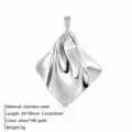 Stainless steel minimalist draped geometric pendant necklace detail, elegant metallic shine. - Geometric Pendant / Silver