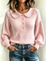 Detalle de jersey rosa de punto acanalado, cuello con volantes y botones, mangas. - S / Tops / Rosa