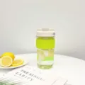 Portable clear plastic water bottle with green silicone band and lemon infuser cup style. - 780ml / Vitality Yellow