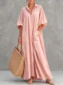 Detalle del vestido camisa rosa oversize con botones, mangas de farol y bolsillos útiles. - S / Rosa