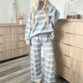 Detailed view of women casual striped lounge set, light blue long sleeve top and wide pants. - S / Top And Bottom / Blue and White Stripes