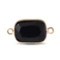 Gros plan détaillé du connecteur en pierre noire rectangulaire bordée d'or à doubles anneaux. - Obsidienne