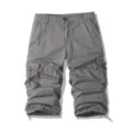 Detailed view of men's casual gray cargo shorts featuring multi-pockets and adjustable drawstrings. - 30 / Gray