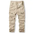 Detailed view of men's khaki tactical cargo pants with multiple utility pockets and durable fabric. - 30 / Khaki