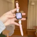 Pink leather watch strap with metal flower charms compatible with Apple smartwatch models. - Pink - Gold Buckle White Flower
