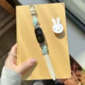 Metal flower leather smart watch band replacement strap with elegant mint green floral charms. - Compatible: Apple 38/40/41/S10(42)mm / Off-White - Blue Flower