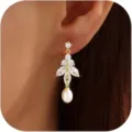 Elegant gold-tone drop earrings with sparkling zirconia and white pearl chic design. - Style 4