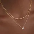 Collana girocollo a doppio strato in zircone placcato oro, stile minimalista elegante. - Collana a Doppio Strato Oro