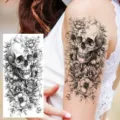Skull floral temporary tattoo sticker for arm and leg, black and white artistic design. - NZ548