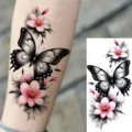 Waterproof temporary tattoo sticker featuring a gorgeous black butterfly and pink floral design. - Butterfly Floral Pattern (NZ517)