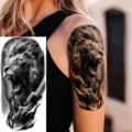 Realistic waterproof temporary tattoo sticker featuring a fierce lion and skull design for arm and thigh. - Lion Skull Style (NZ1239)
