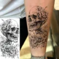 Temporary tattoo sticker featuring detailed gothic skull and blooming roses design for arm leg. - NZ551
