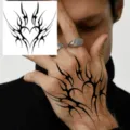 Temporary tattoo sticker featuring stylish tribal heart and spear design for back of hand. - Heart Spear Totem (HA039) / 8x8cm