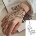 Black and white lotus flower tattoo sticker variant, elegant floral hand or neck body art design. - HL090 / 12x8cm