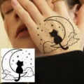 Temporary hand tattoo sticker featuring a cute black cat sitting on crescent moon and stars. - HA145