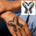 Waterproof temporary tattoo sticker featuring dove and praying hands for hand use. - Dove & Cross (HA255) / 8x8cm