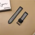 Detailed view of the black and white houndstooth watch strap with leather edges and metal buckle. - Huawei Watch 3/3pro / Black & White Check
