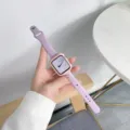 Silicone watch strap detail view, soft purple wavy band with pink protective case, cozy setup. - 49mm / Lavender + Pink Case