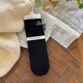 Comodi calzini neri da donna a metà altezza con grazioso fiocco, stile coreano slouch. - Taglia unica / Nero