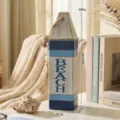 Mediterranean wooden buoy wall decor with rope and beach lettering for coastal home - L