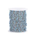 Close-up detail of stainless steel beaded chain featuring blue enamel beads for DIY crafts. - Steel Chain with Sky Blue Beads