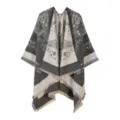 Close-up detail of the women's floral knit cape poncho with elegant fringe hem design. - Tops / Gray