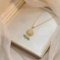 Collar con Colgante de Girasol Circonita Oro, Elegante Joya Cadena de Clavícula Mujer. - Oro y Verde Esmeralda