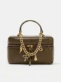 Green leather box bag with chunky gold chain and cute charms, stylish top handle design. - Green
