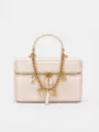 Chic pink leather vanity cosmetic bag featuring a bold gold chain strap and stylish metallic charms. - Pearl Pink