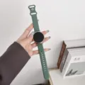 Detailed view of the dark green silicone smartwatch strap, flexible and comfortable for daily wear. - Pine Green
