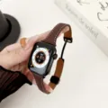 Detailed close-up of the litchi pattern leather magnetic watch strap showing fine texture and sleek clasp. - Dark Coffee Red Brown