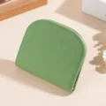 Green leather short wallet for women, minimalist arch design with pebble grain and stitching. - Light Green