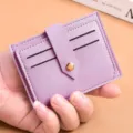 Slim purple PU leather card holder with multiple slots and secure snap button closure. - Purple