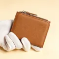 Brown leather short wallet coin purse card holder with zipper closure for daily use style. - Brown