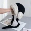 Black knitted ushanka hat with warm fluffy fleece lining, earflaps and long braided straps for winter. - M (56-58cm) / Black