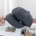 Grey herringbone tweed newsboy cap featuring a stylish black leather strap and gold buckle. - Adjustable / Dark Gray