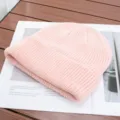 Close-up detail view of a soft pink knitted beanie hat, showing fine texture and cozy fabric. - One Size (High Elasticity) / Light Pink