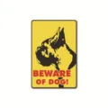 Close-up detail of the vintage yellow metal warning sign featuring a classic dog graphic. - 7305
