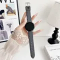 Detail shot of grey silicone tire pattern smartwatch replacement strap on clean white desk. - Custom: 20mm / Tire Pattern Silicone - Gray
