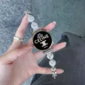 Gros plan détaillé d'un bracelet de montre connectée en zircone cœur avec maillons métalliques. - Personnalisé 18mm / Lumière Stellaire