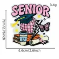 Detailed view of 2027 graduation senior pink embroidered patch with cute butterfly and books. - Pink Graduation Patch 1# / Pink