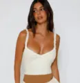 White lace camisole top detail, featuring ruffled straps and bow accent for chic style. - S / Tops / White Style B